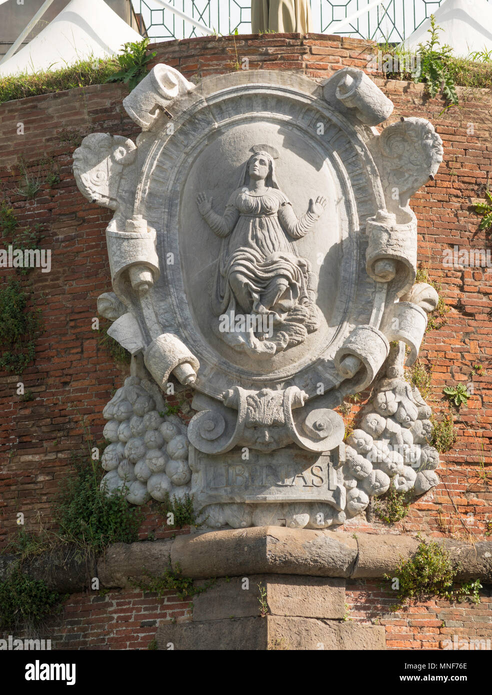 Stone carving of the Madonna on Lucca city walls, Tuscany, Italy, Europe Stock Photo