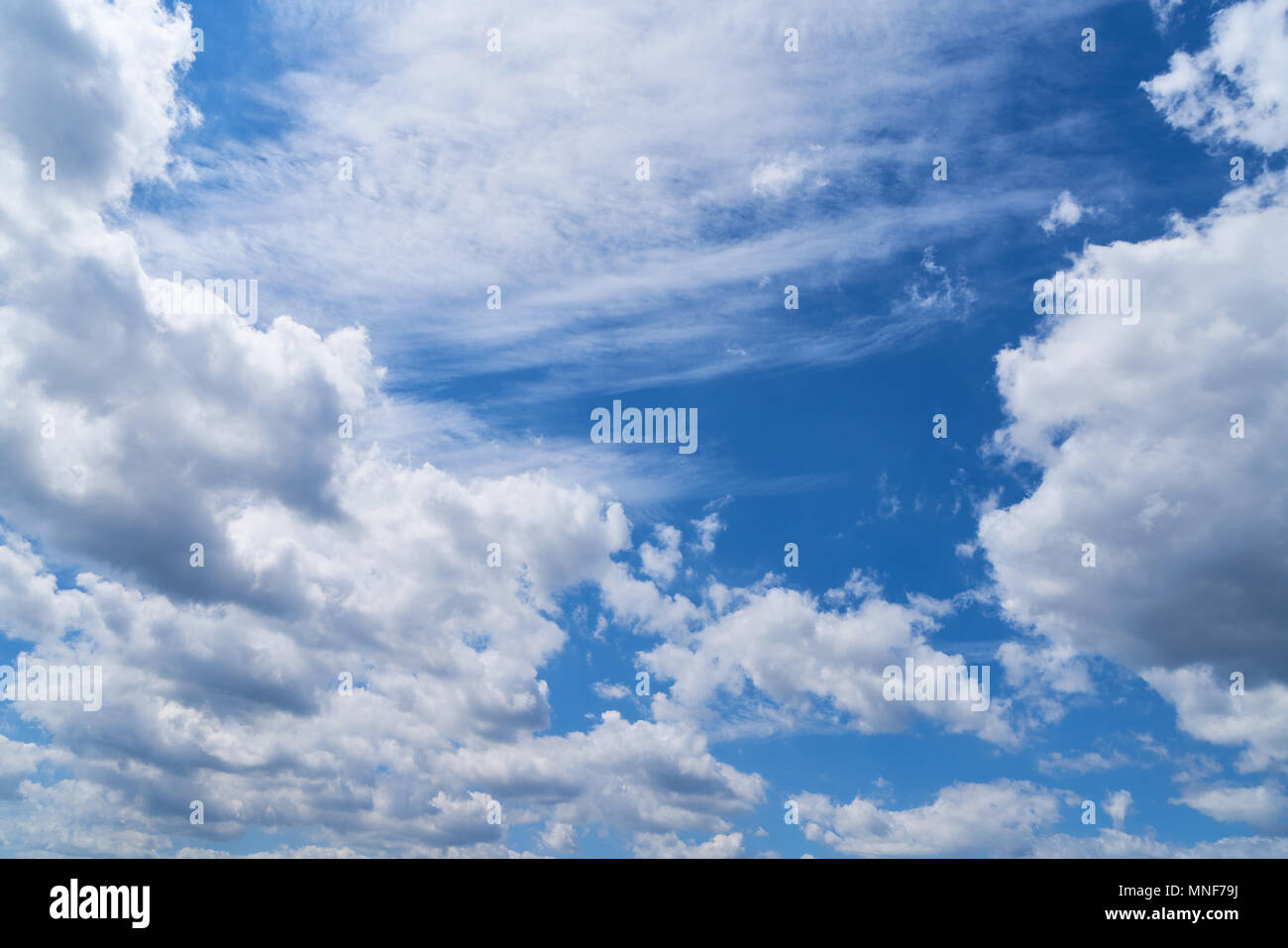 Blue sky with many white clouds during the daytime Stock Photo - Alamy