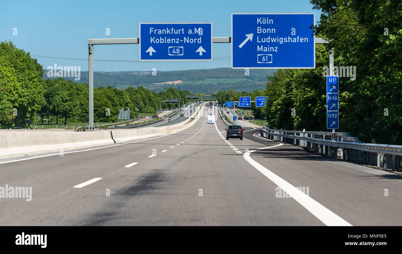 Germany, Koblenz May 2018. German highway with visible cars, signs and exits. Motorway without speed limit. Stock Photo