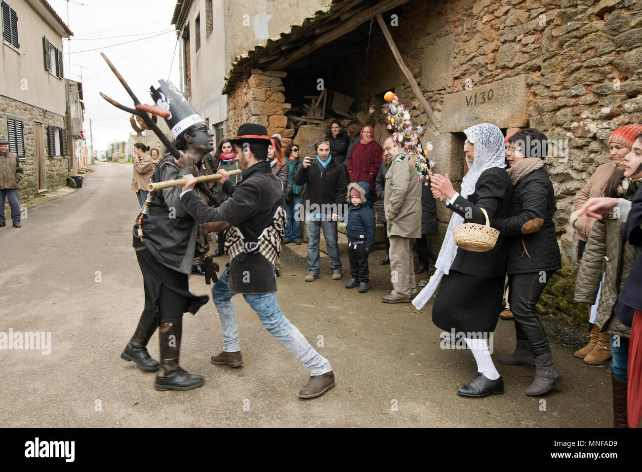 The Farandulo Character Makes Mischief Trying To Paint The Girl With Black Burnt Cork The Girl Is Defended By The Boy Winter Solstice Festivities Stock Photo Alamy