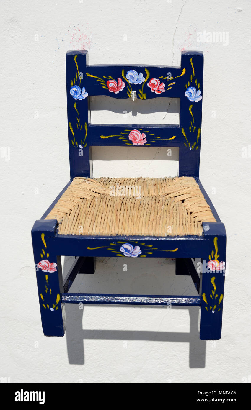 Painted chair, a traditional handicraft of Alentejo. Monsaraz, Portugal Stock Photo