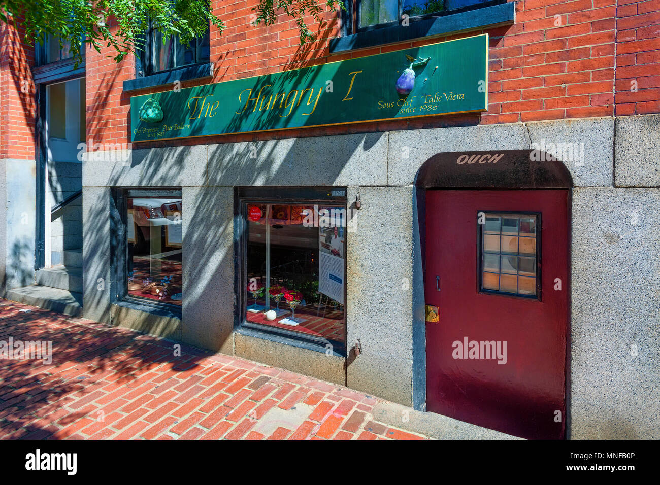 Boston, Massachusetts, USA - September 12, 2016: A little restaurant on Beacon Hill in Boston, Massachusetts.  The sign above the door 'OUCH' cautions Stock Photo