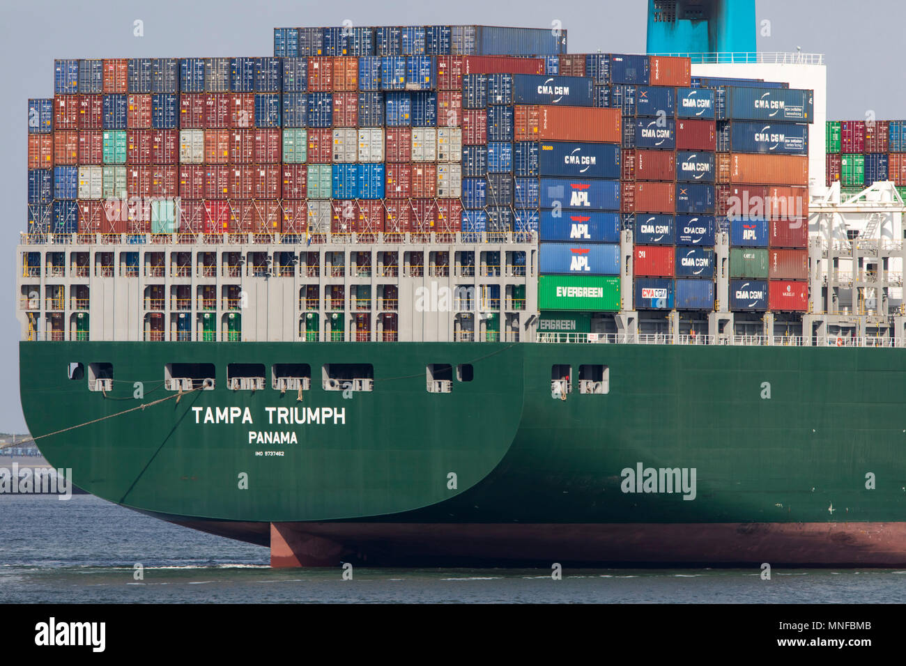 Container ship Tampa Triumph, enters the seaport of Rotterdam, Netherlands, deep sea port Maasvlakte 2, on a man-made land area off the original coast Stock Photo