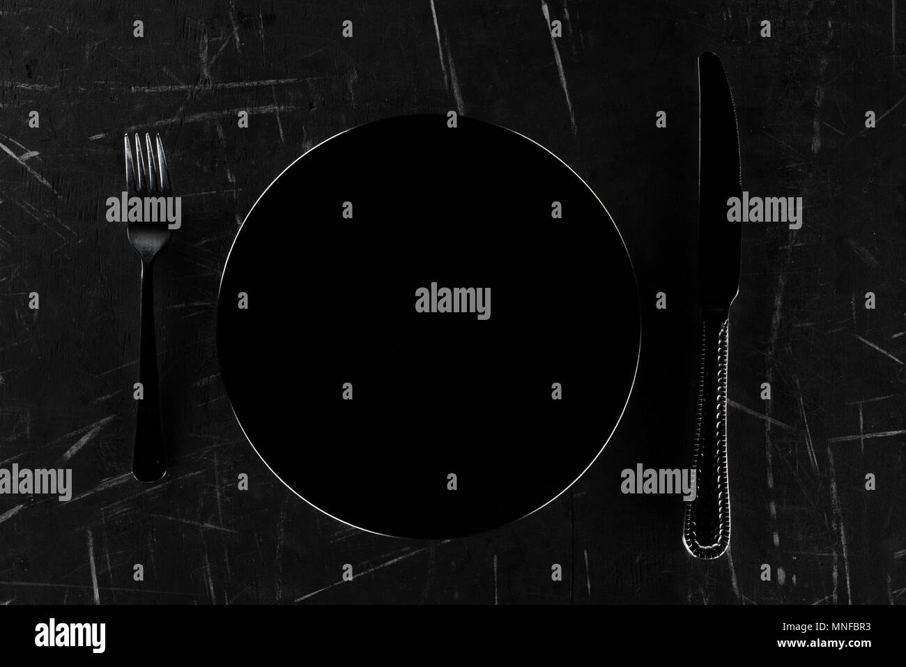 plate with fork and knife Stock Photo - Alamy