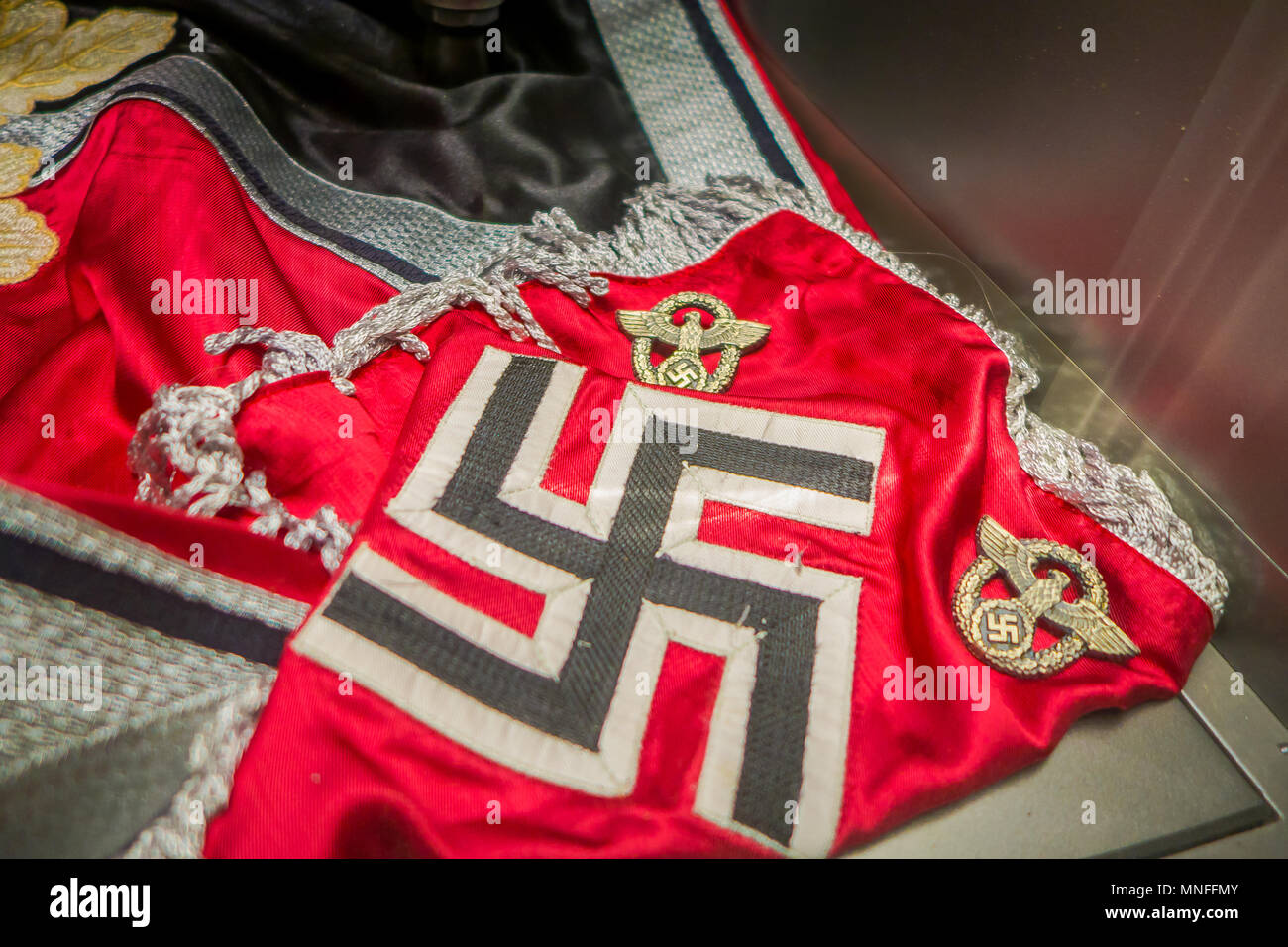 BELARUS, MINSK - MAY 01, 2018: Close up of Hakenkreuz swastika nazi sign over a red brand inside of State Museum of the Great Patriotic War of the museum in Minsk Stock Photo