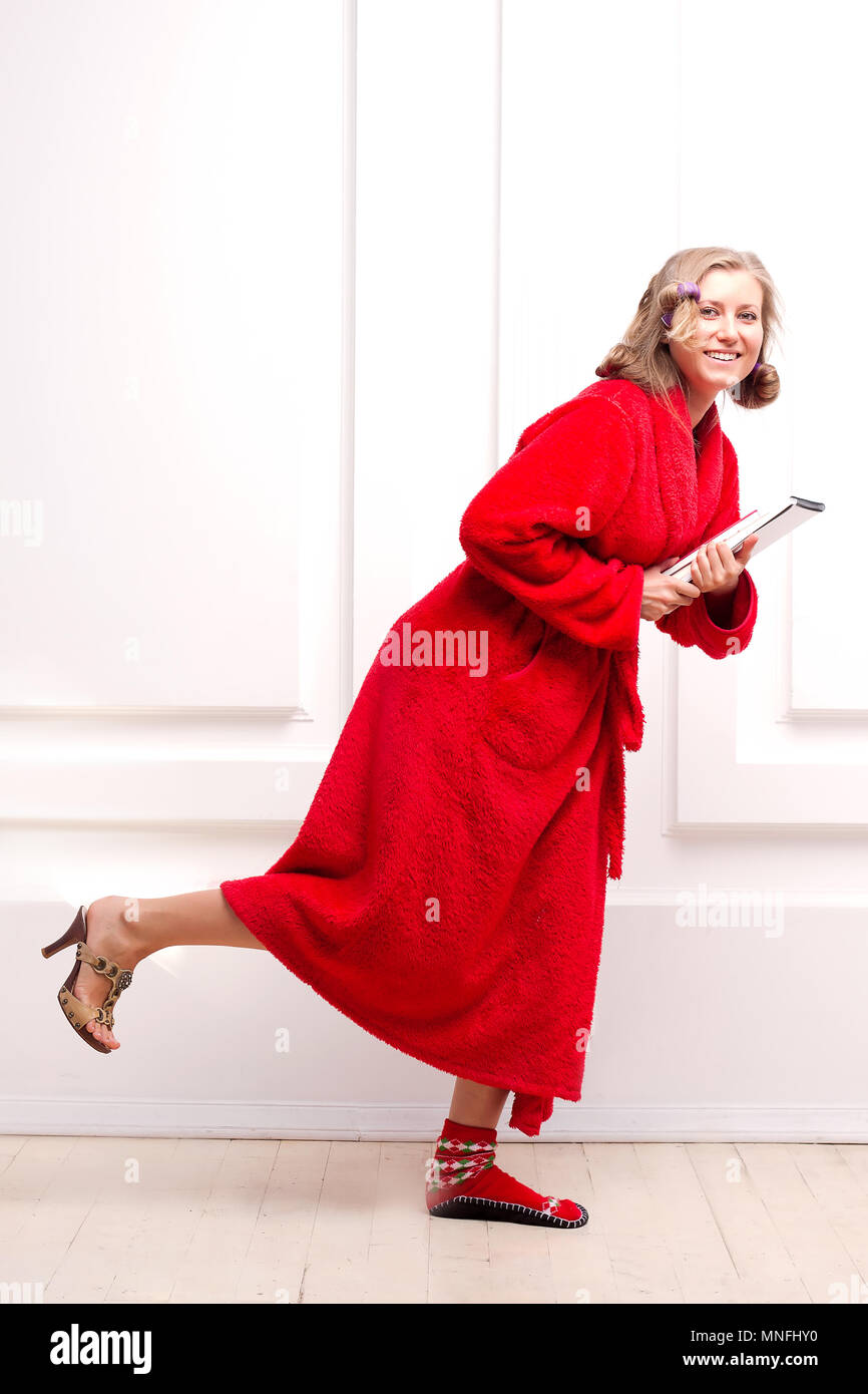 girl in the house shoes and high heel shoes Stock Photo