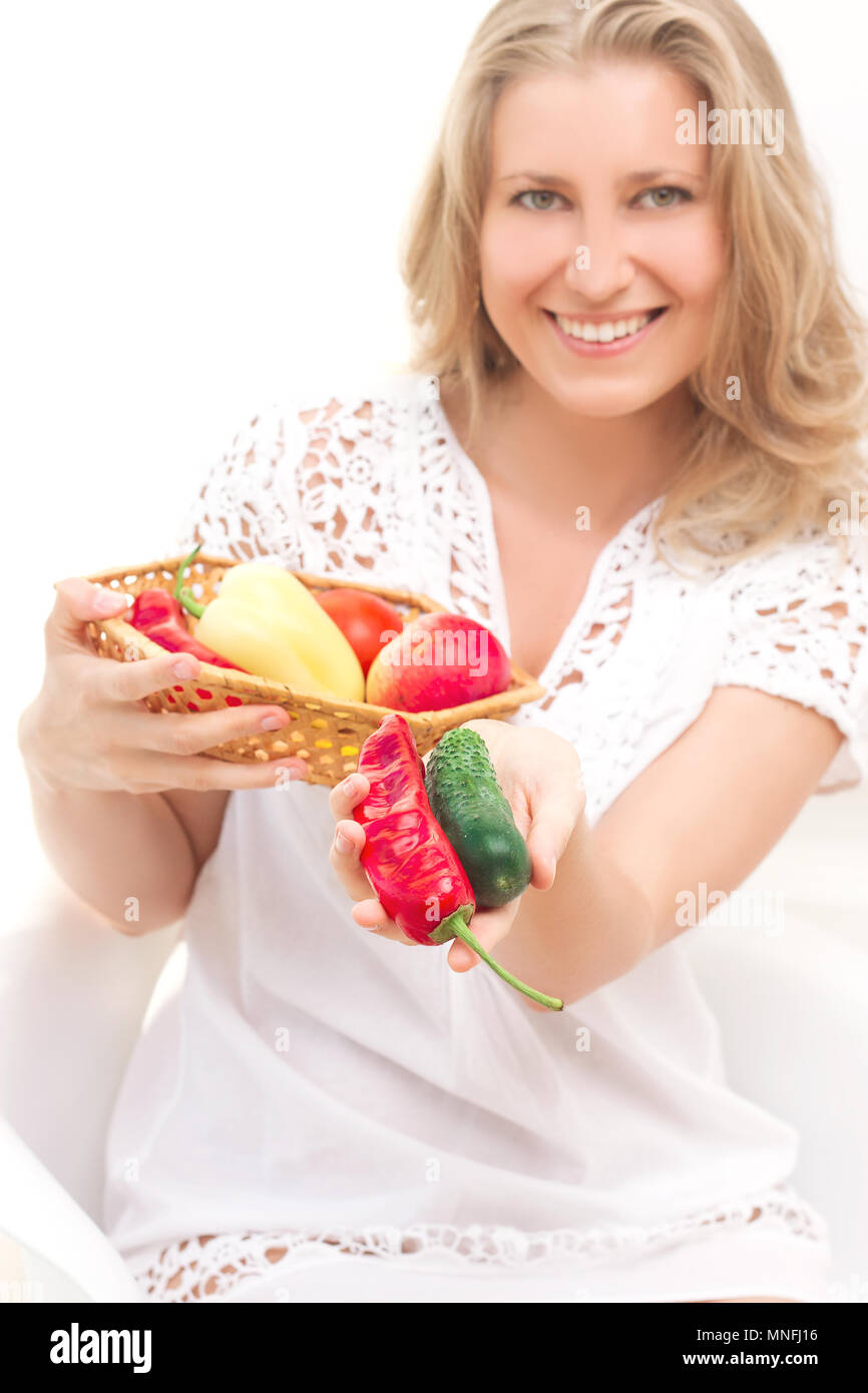 Young smiling woman with fruits and vegetables. white background Stock ...