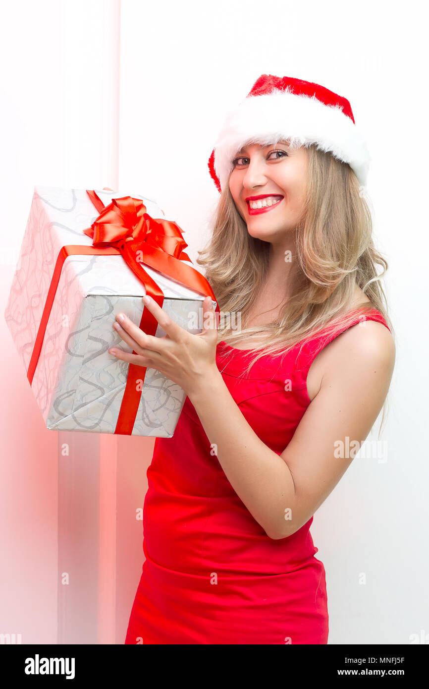 Christmas woman portrait hold red christmas gift Stock Photo - Alamy