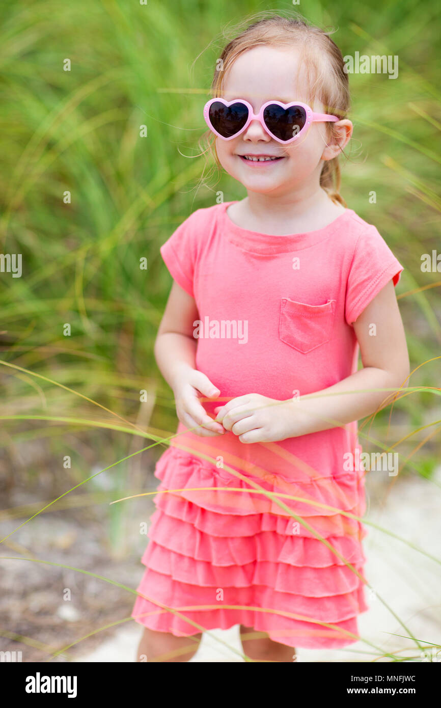 Portrait of adorable little girl outdoors Stock Photo - Alamy