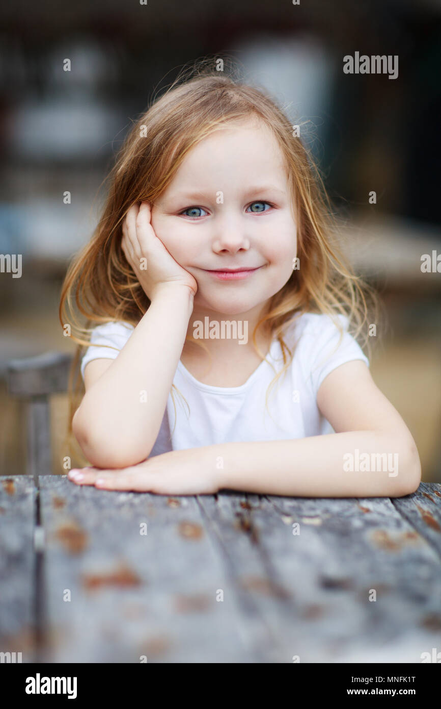 Portrait of cute little girl outdoors Stock Photo - Alamy