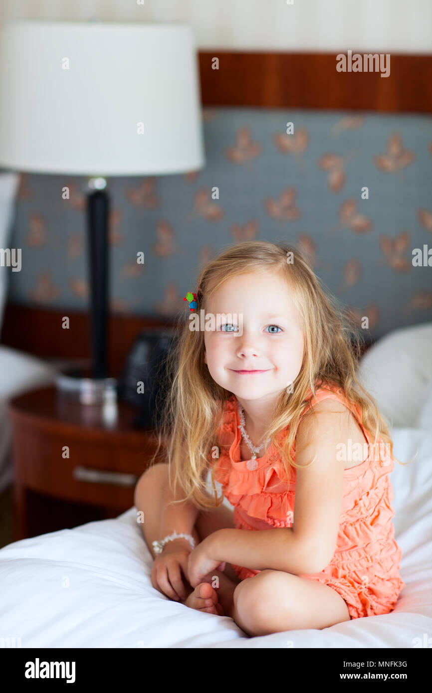 Portrait of adorable little girl at hotel room Stock Photo Alamy