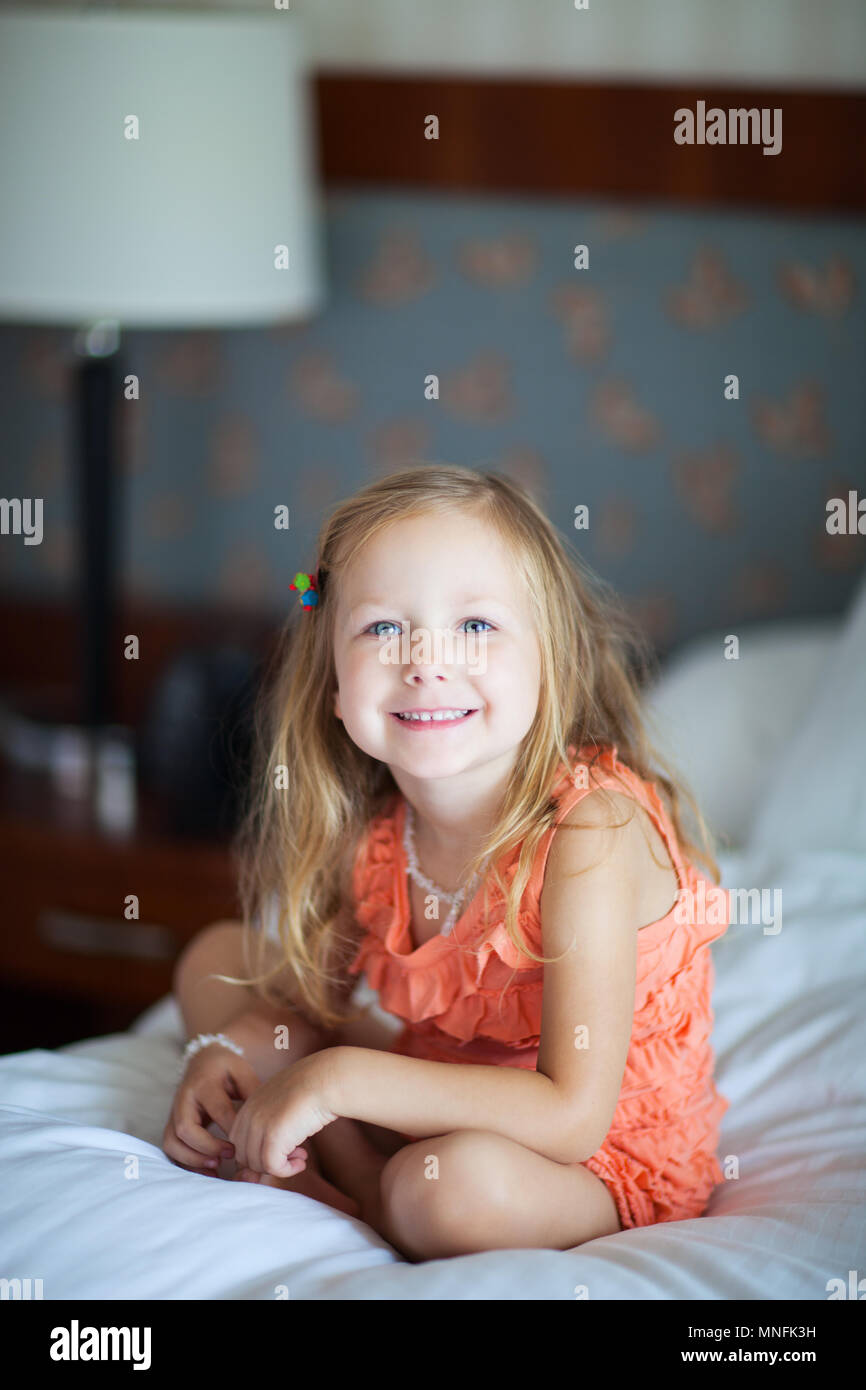 Portrait of adorable little girl at hotel room Stock Photo Alamy