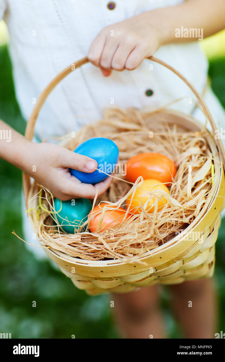 Close up of colorful Easter eggs in a basket Stock Photo