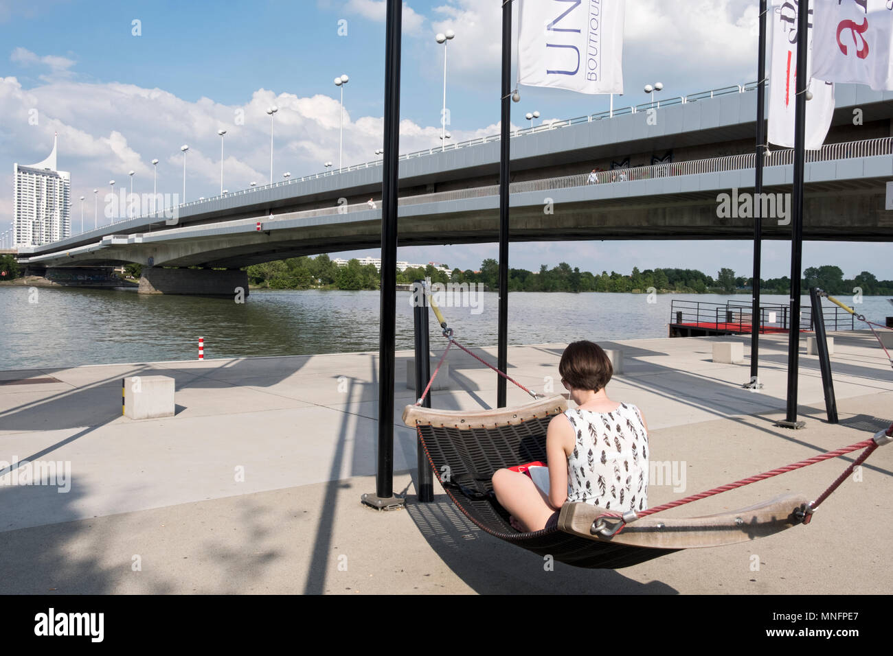 A young lady reading a book on a hammock on the banks of the Danube River  in Vienna, Austria Stock Photo - Alamy