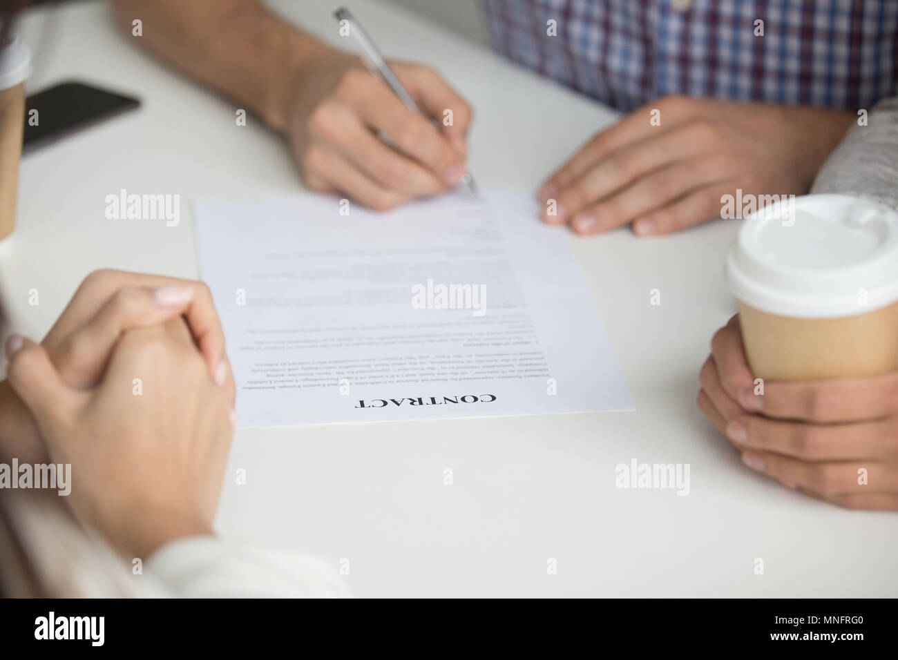 Husband signing contract of buying house Stock Photo Alamy