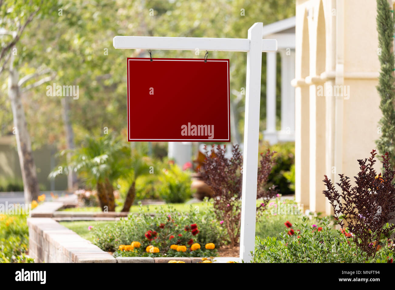 Blank Sale Real Estate Sign in Front of House Stock Photo - Alamy