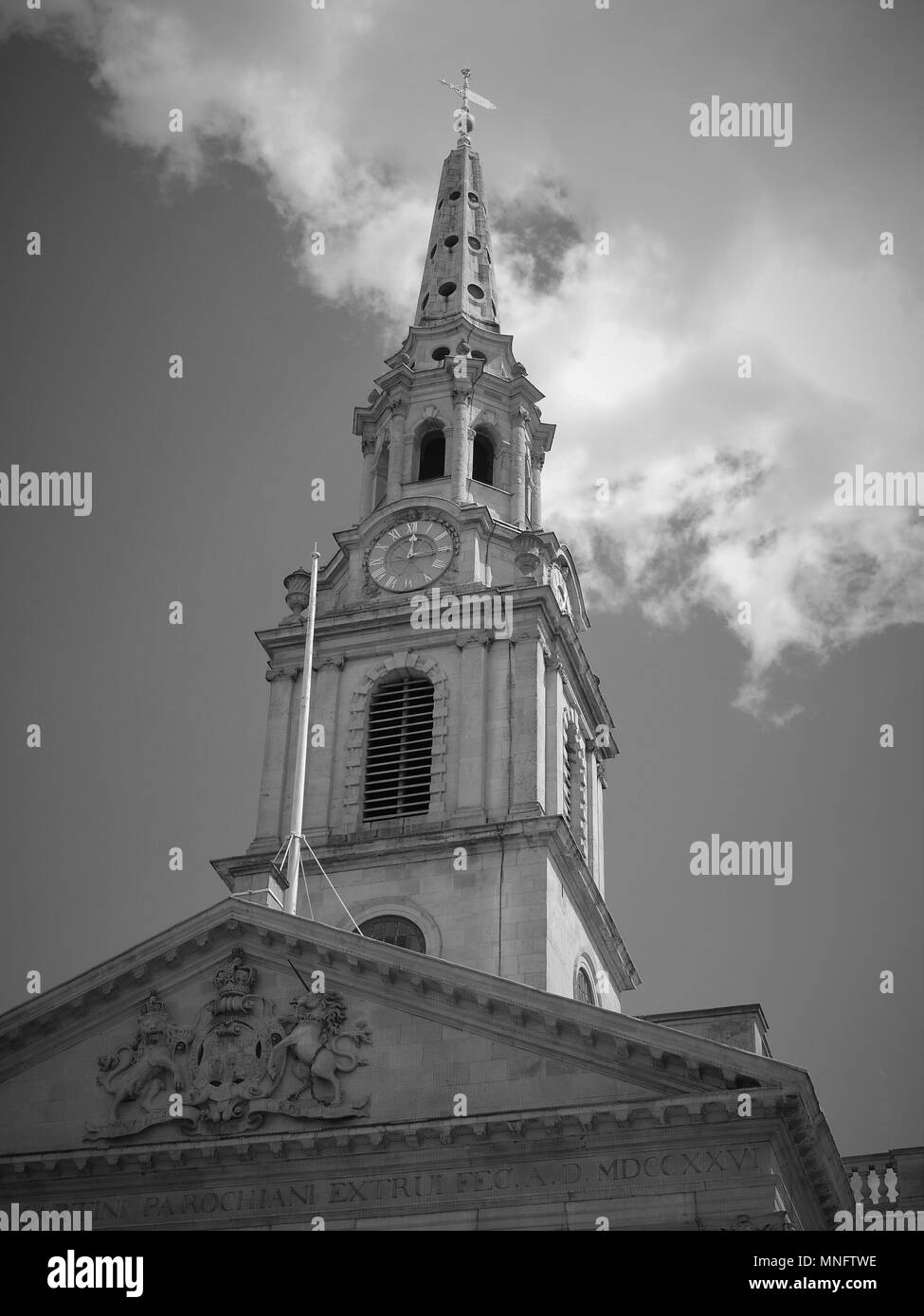 LONDON - MAY 10, 2018: ( Image digitally altered to monochrome ) Clouds passing the iconic St Martin-in-the-Fields church spire Stock Photo