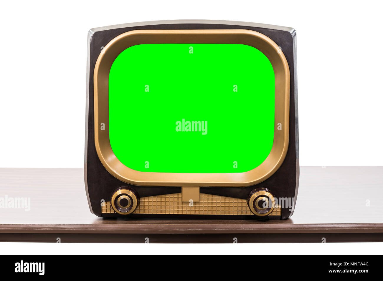 Vintage 1950s television on table isolated on white with chroma key green screen and clipping path. Stock Photo