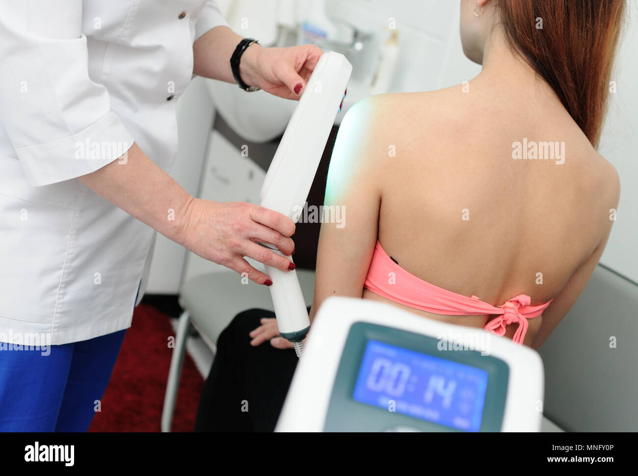 young girl is undergoing treatment of skin diseases Stock Photo