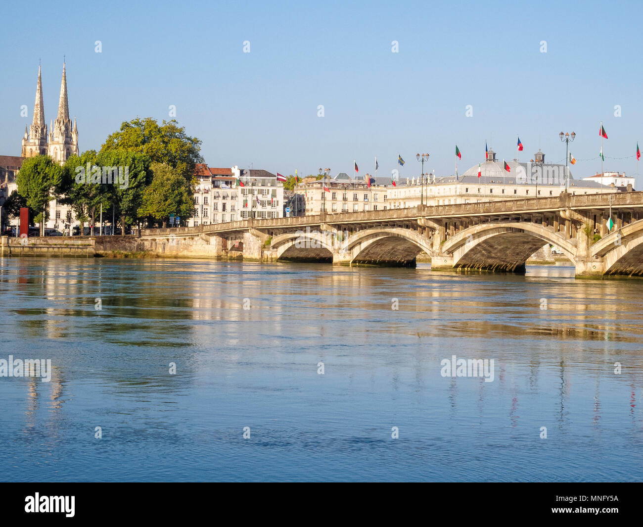 Saint-Esprit bridge with flags over the Adour River - Bayonne, France Stock Photo