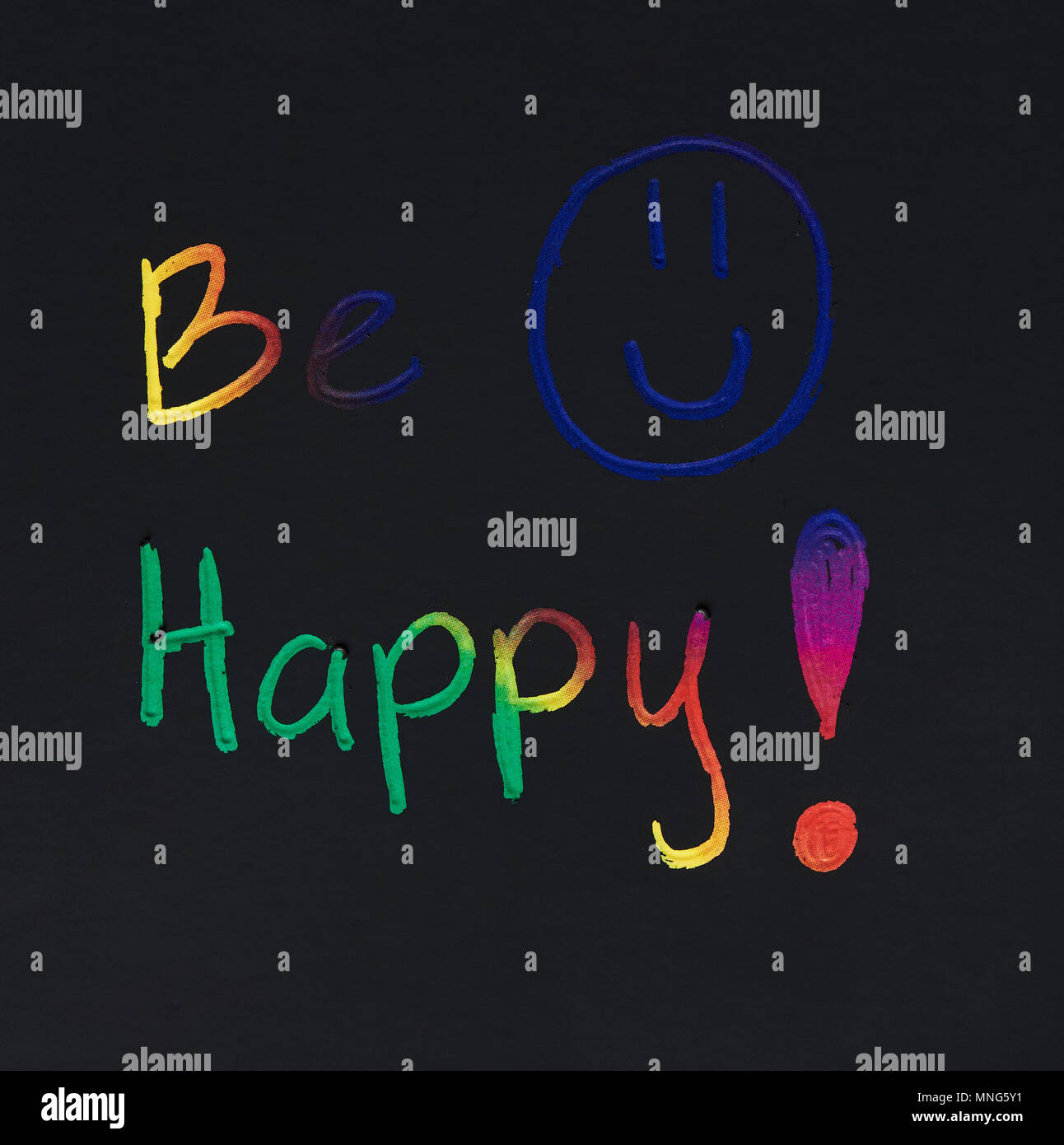 Be happy smile message on black paper background Stock Photo