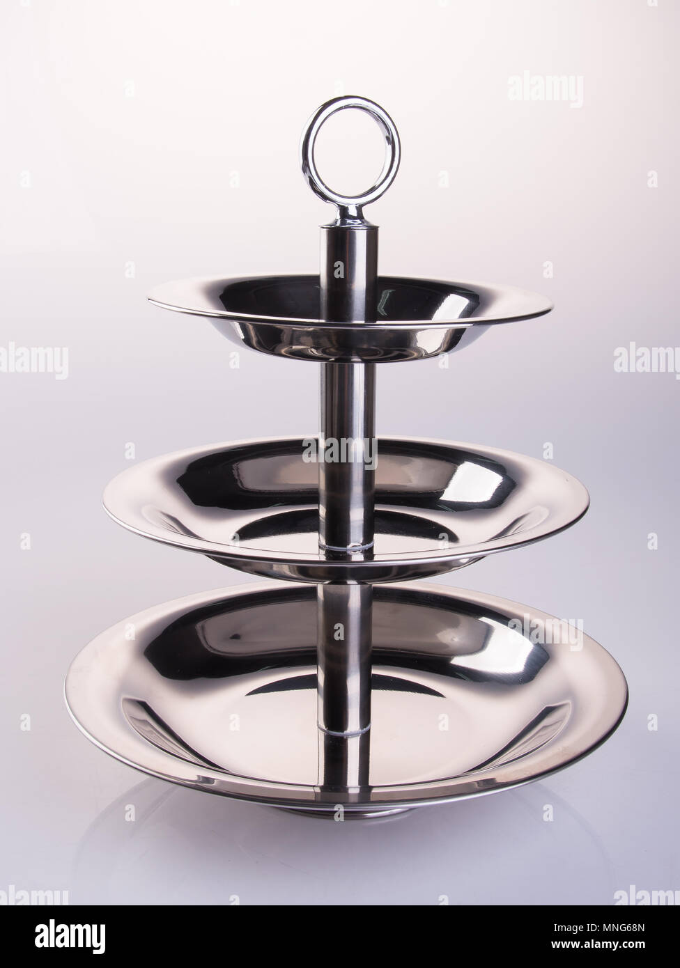 tray or three tier serving tray on a background Stock Photo - Alamy
