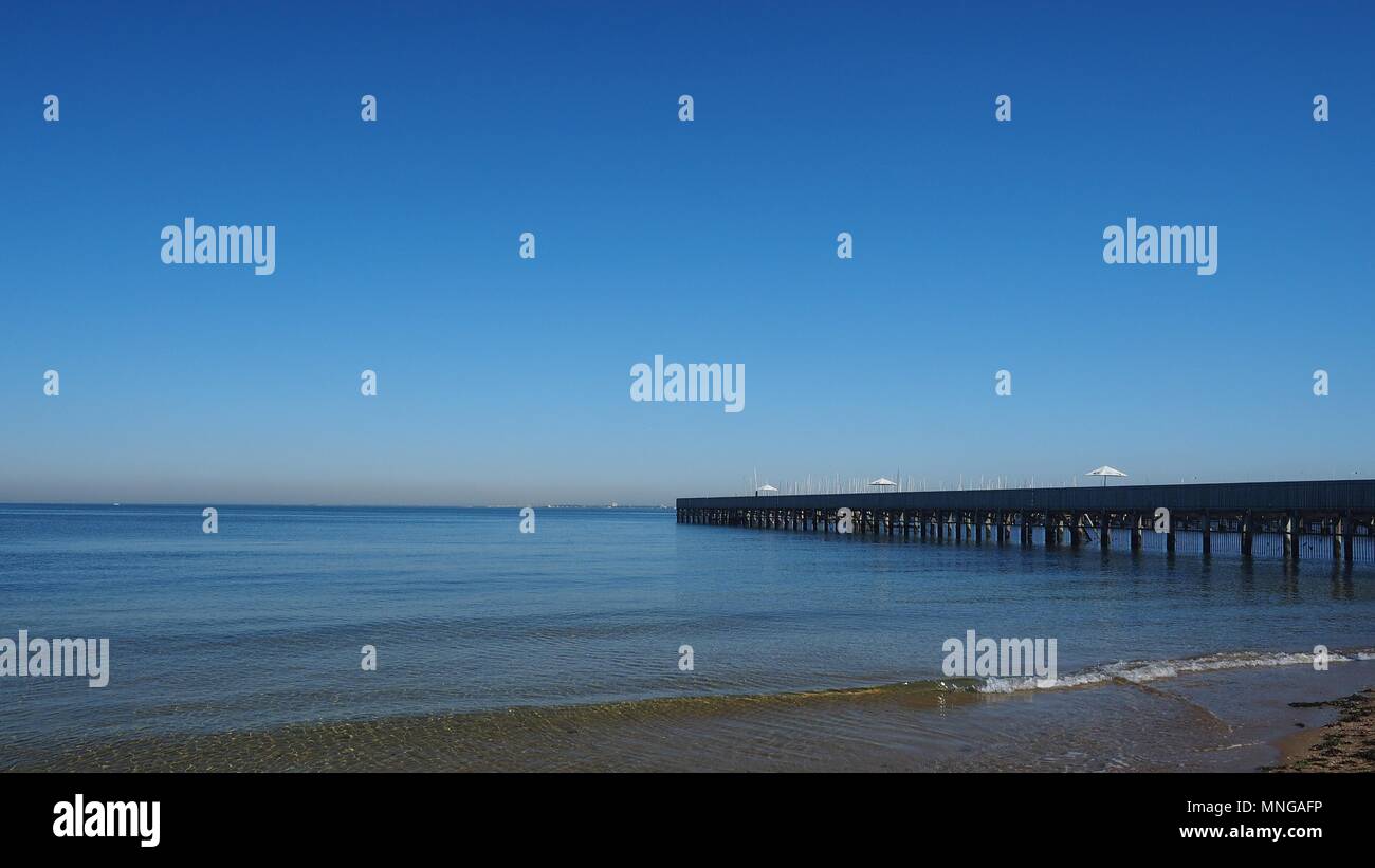 Brighton Baths and still ocean on a blue sky morning, Melbourne ...