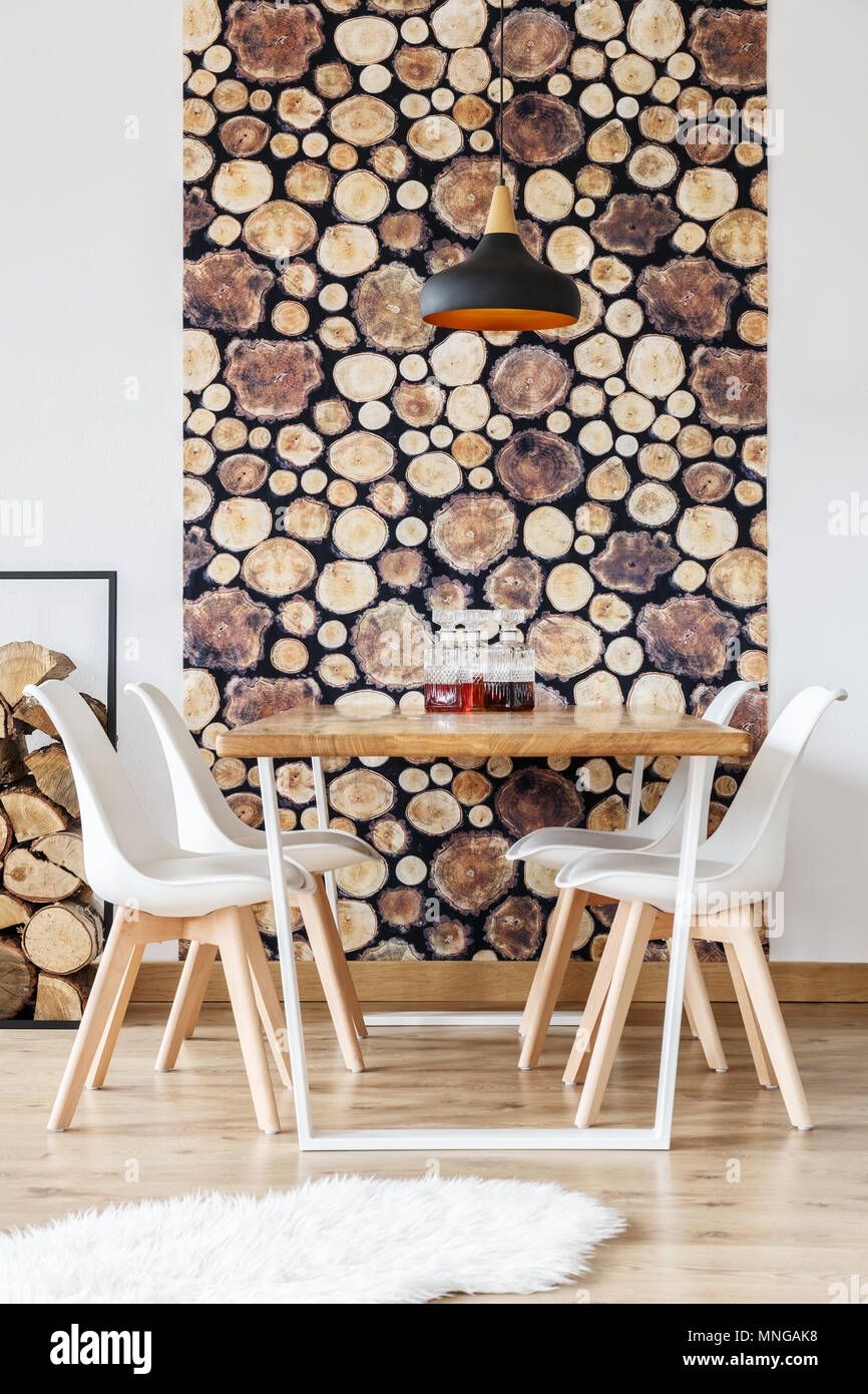 Wooden design details in warm winter interior of dining room with white ...