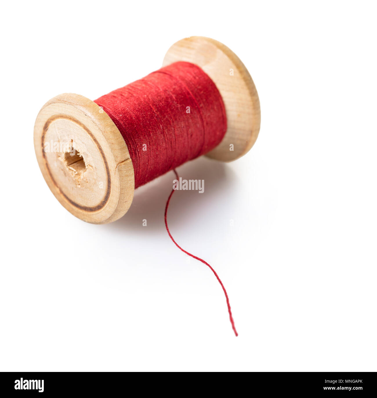 A Needle and red thread over white Stock Photo - Alamy