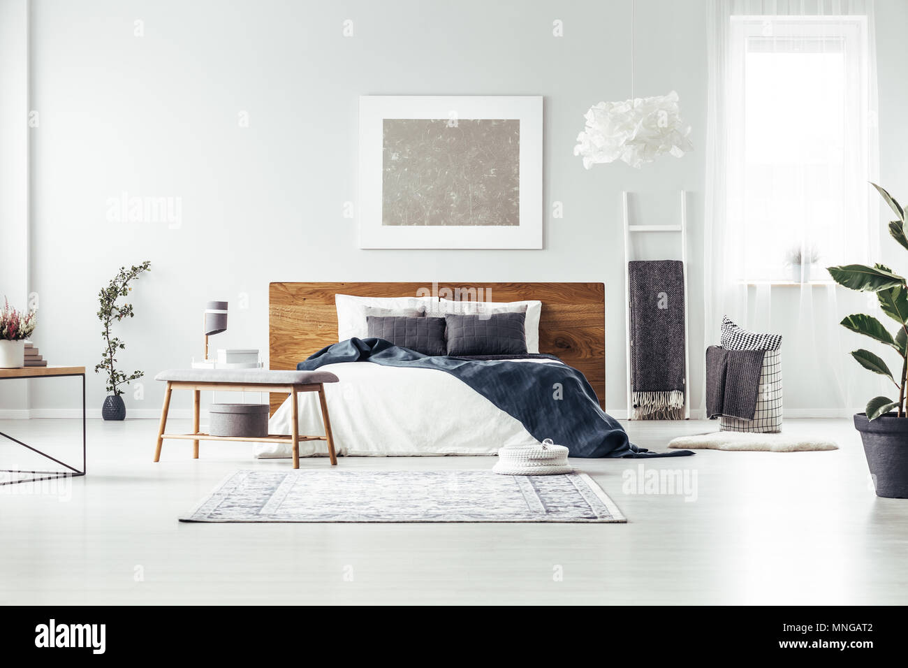 Carpet And Wooden Bench Near King Size Bed With Navy Blue