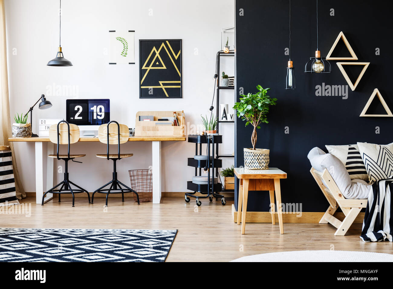 Stylish Black And White Nordic Style Open Space Apartment With Wooden Furniture Office Workspace With Desk And Computer And Spacious Living Room Wit Stock Photo Alamy