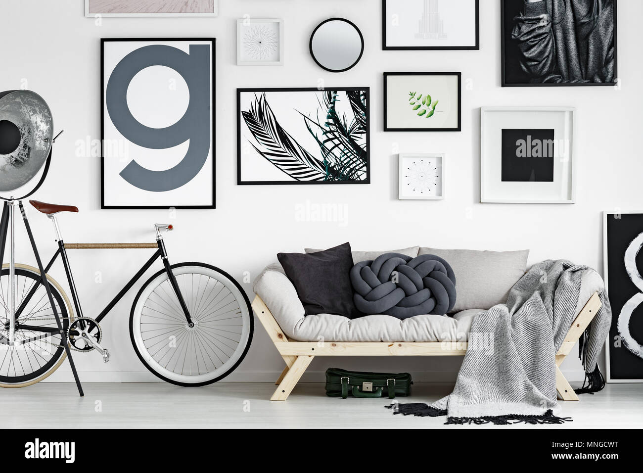 Vintage bike by wooden sofa in scandinavian style living room Stock Photo -  Alamy
