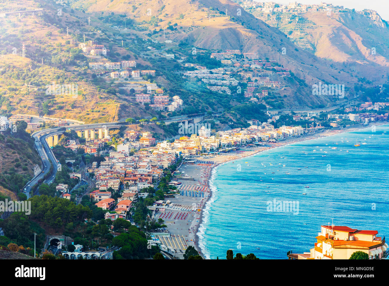 Travel to Sicily, Italy - above view of Letojanni resort town of coast of Ionian Sea from Taormina city in summer day Stock Photo