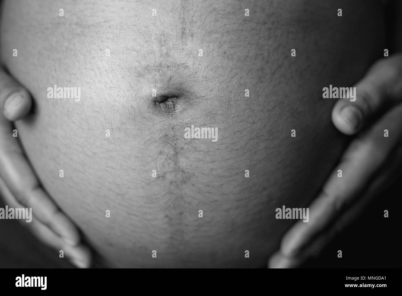 Asian pregnant woman belly with hands. Pregnancy concept Stock Photo