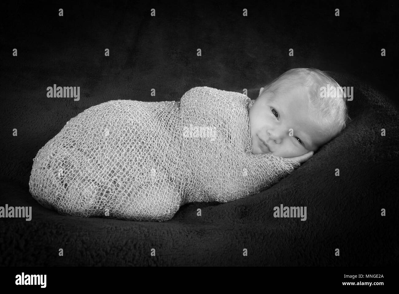 baby girl swaddled Stock Photo