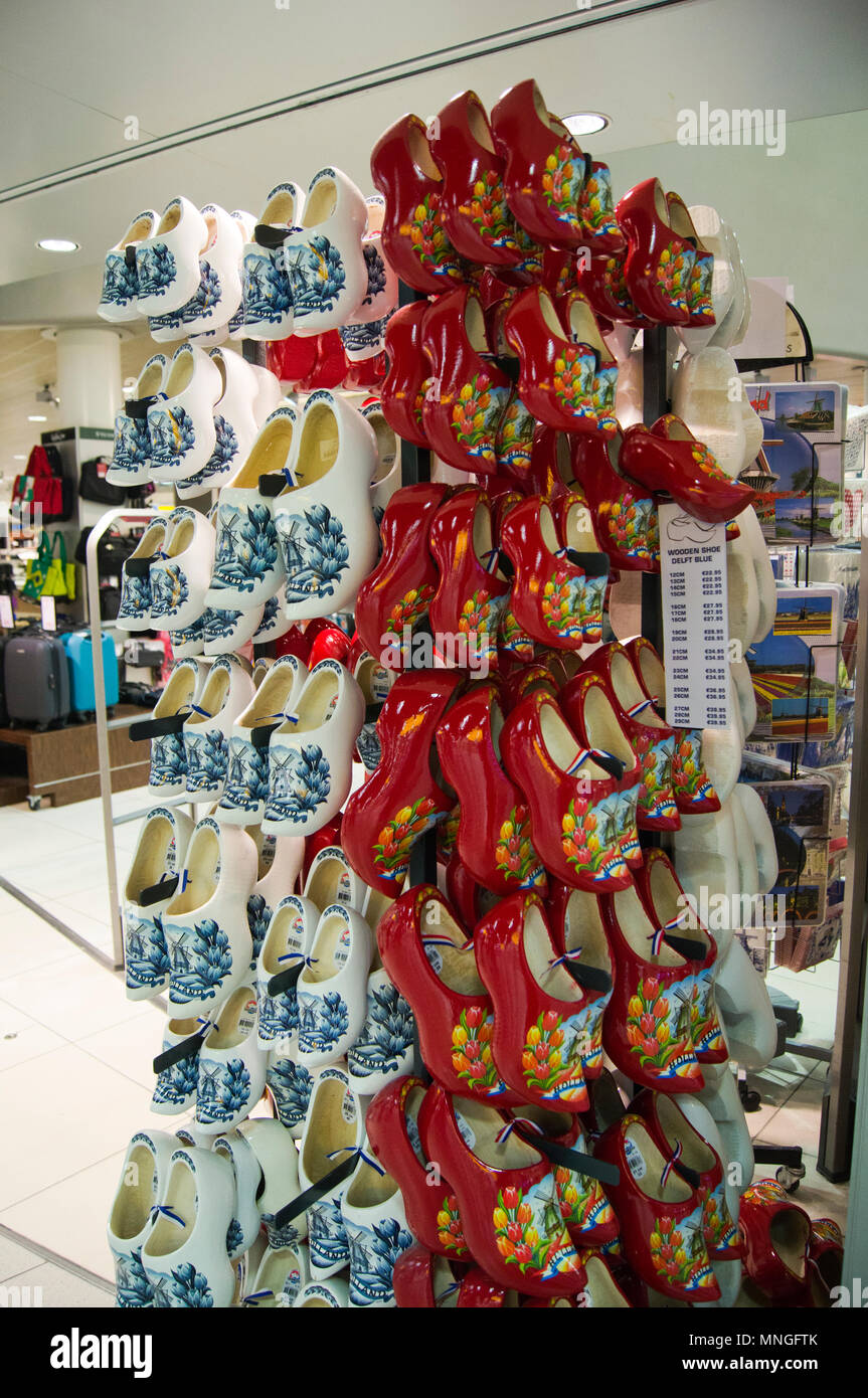 Red and white Dutch-themed clogs on sale in the departure lounge at Schiphol International Airport in Amsterdam, The Netherlands. Stock Photo
