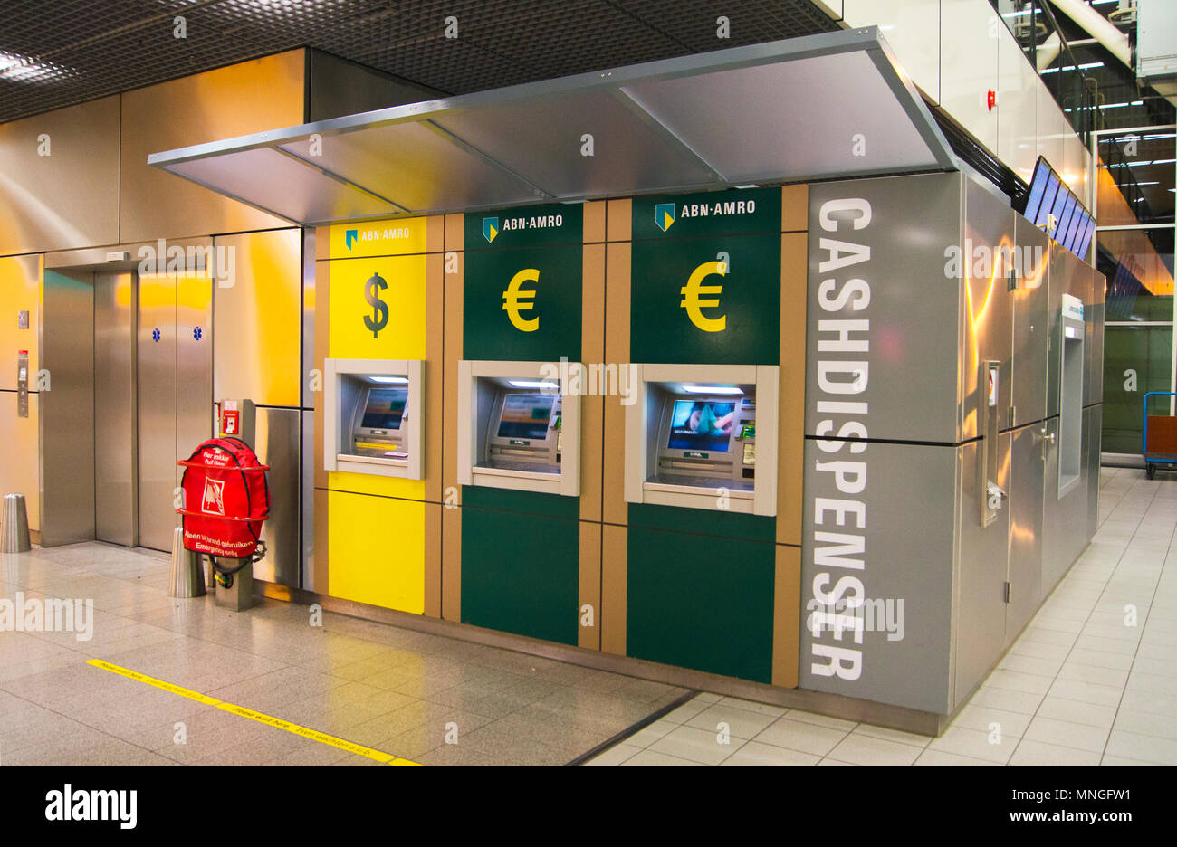 Automated cash dispensers in the departure lounge at Schiphol International Airport in Amsterdam, The Netherlands. Stock Photo