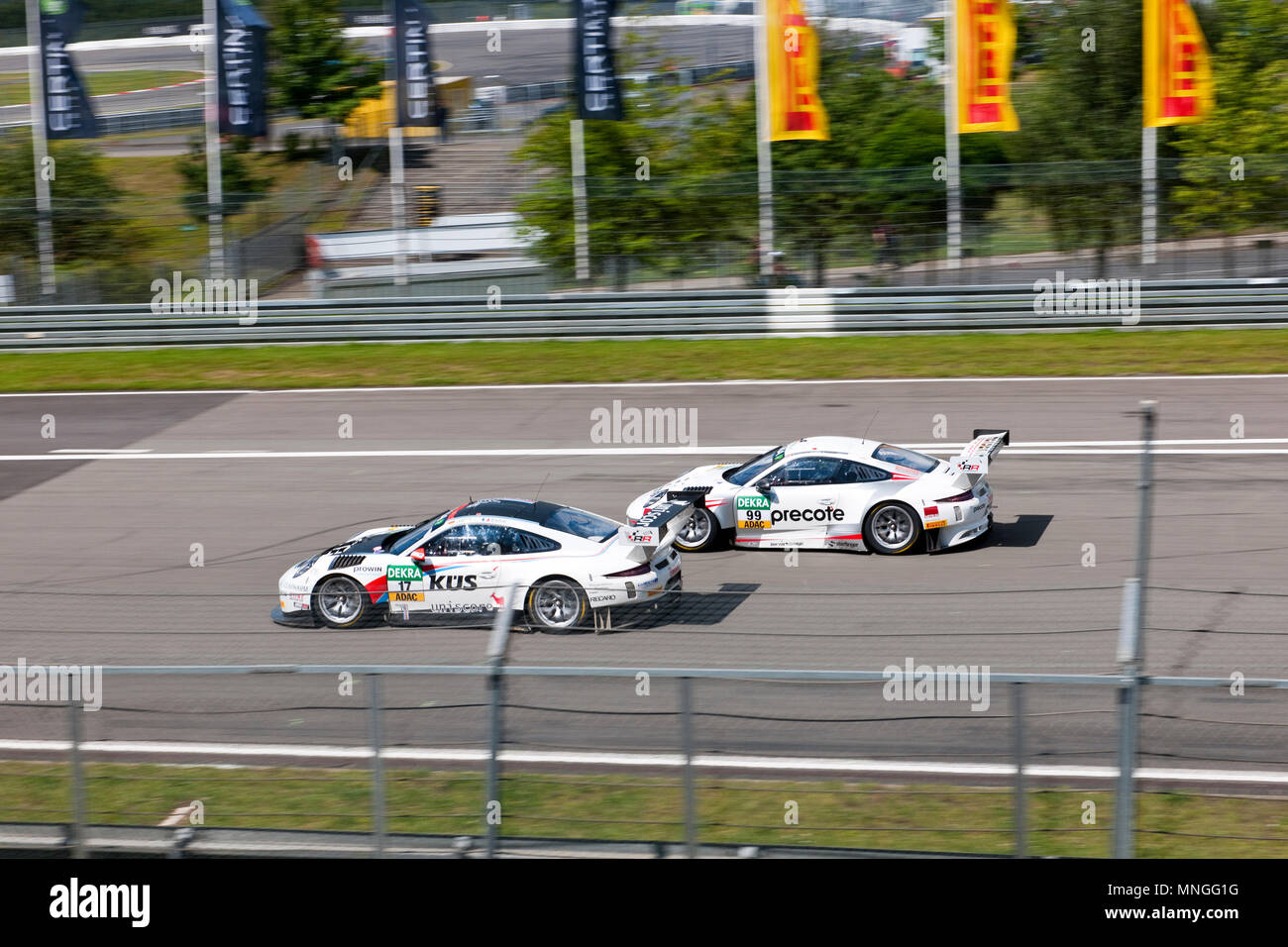 two Porsche GT3 fighting at Nuerburgring, racetrack, track, F1, DTM, GT Masters, Porsche Cup, Formula, racing, green hell, Nuerburgring, Rheinland-Pfa Stock Photo