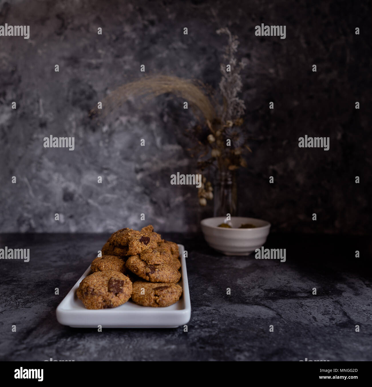Hazelnut Chocolate Chip Cookies, Dark Background Stock Photo