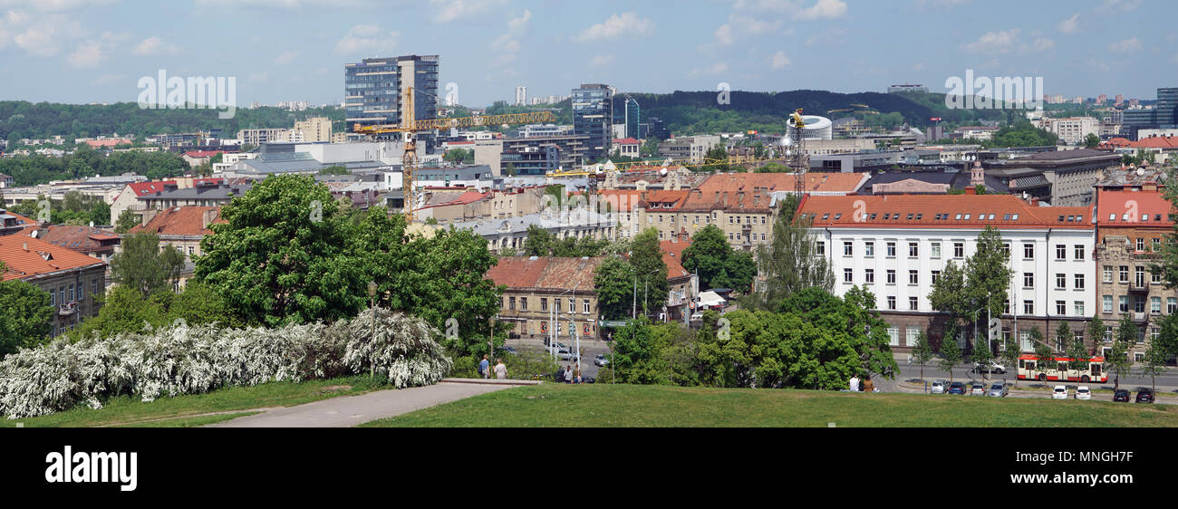 VILNIUS, LITHUANIA - MAY 16, 2018: Panorama of the spring sunny city and public garden from top of the old Tauras mountain. Are well visible historic Stock Photo