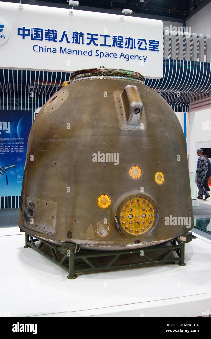 The Shenzhou-10 re-entry module, which took three astronauts to the Tiangong-1 station in June 2013, at the 64th IAC in Beijing, China. Stock Photo