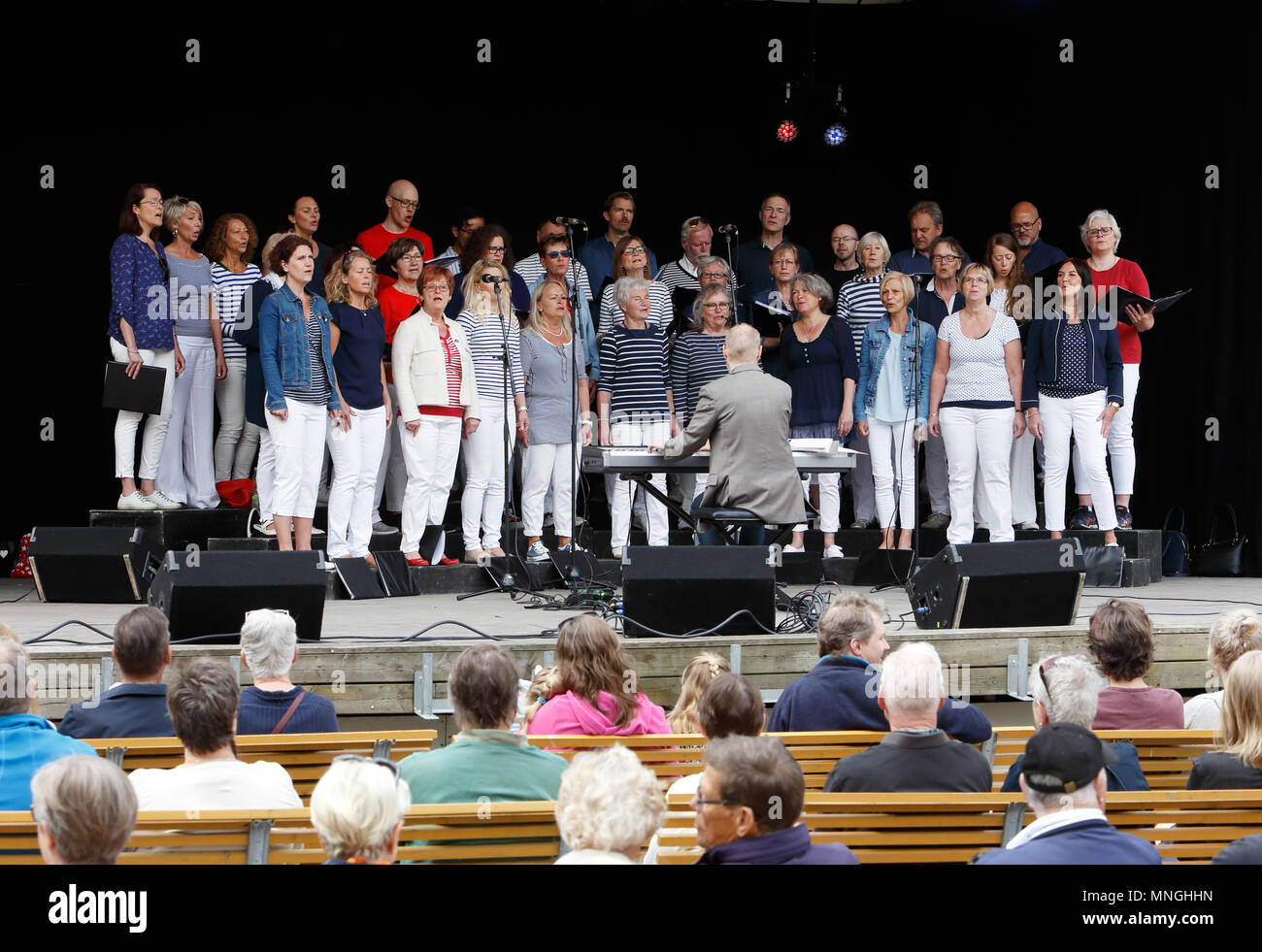 Strangnas, Sweden - May 20, 2017: he singing choir Lovsangarna perform for an audience at an outdoor stage in the Ugglans park during the Kultur 17 cu Stock Photo