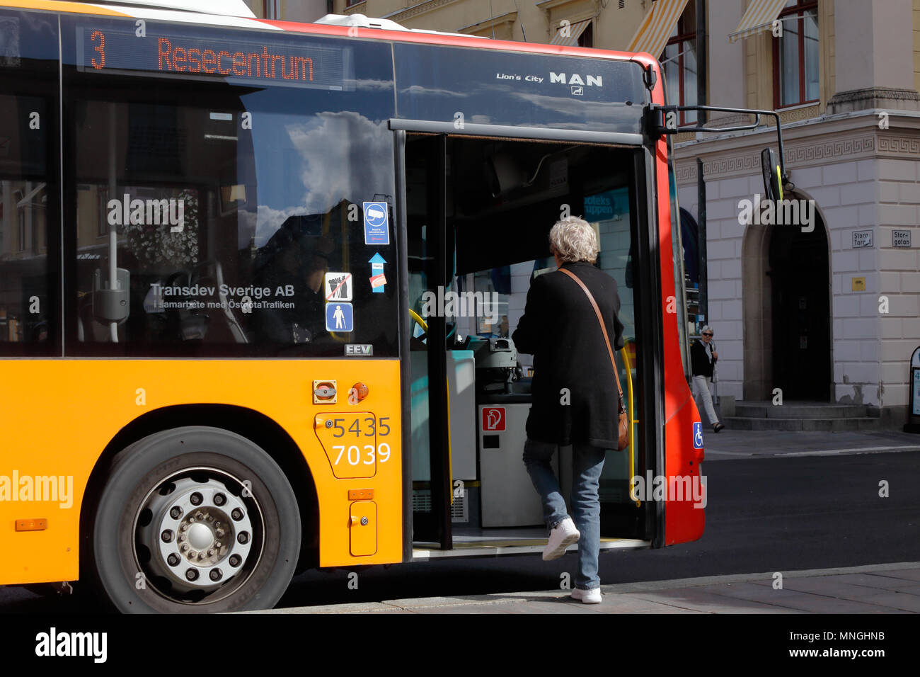 Linkoping, Sweden - August 21, 2017: One person boarding the bus in service on line 3 in downtown. Stock Photo