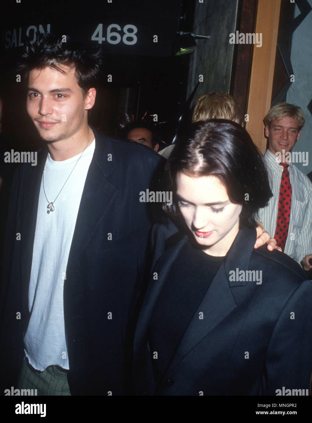 WESTWOOD, CA - SEPTEMBER 24: (L-R) Actor Johnny Depp and actress Winona Ryder attend the 'Pacific Heights' Westwood Premiere on September 24, 1990 at Avco General Cinemas in Westwood, California. Photo by Barry King/Alamy Stock Photo Stock Photo
