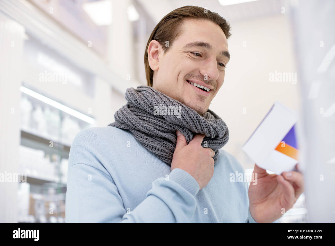 Happy jovial man medicining sore throat Stock Photo Alamy
