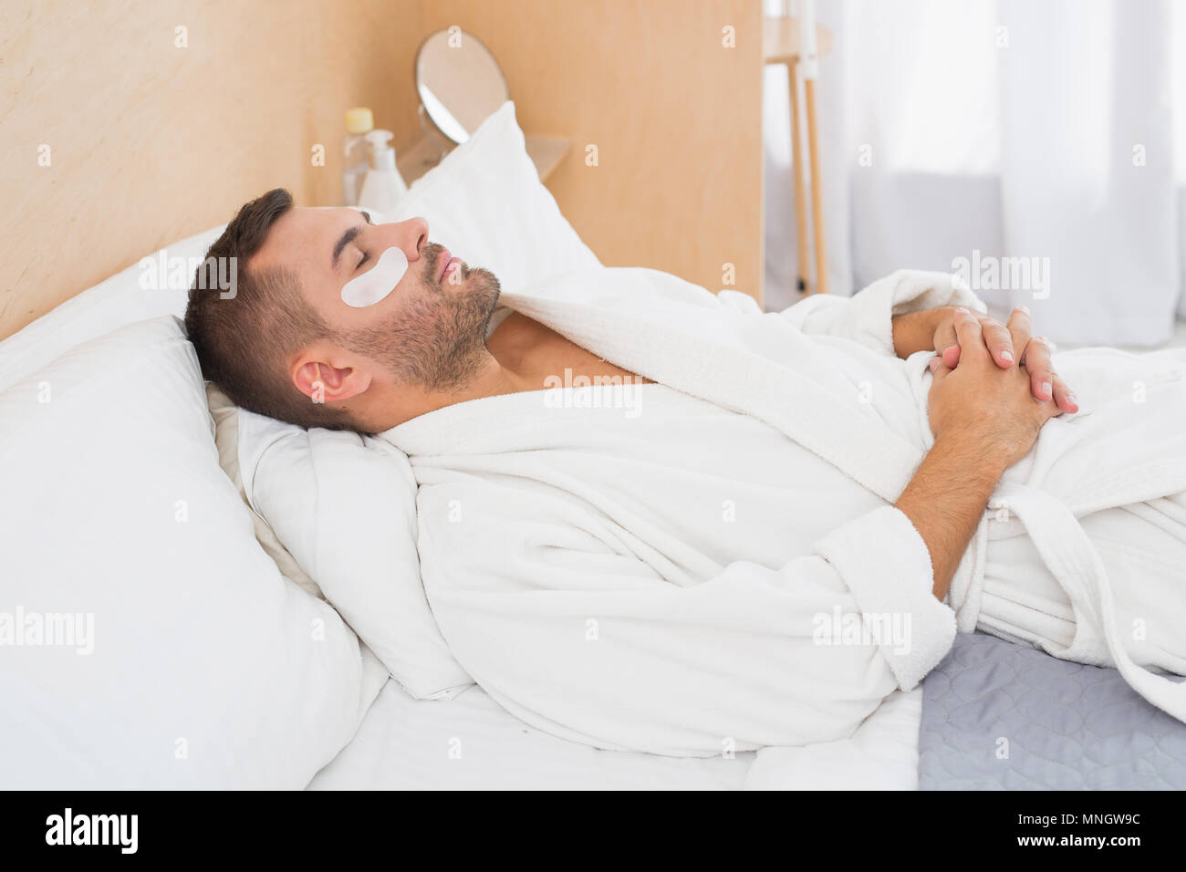 Good looking attractive man wearing eye patches Stock Photo