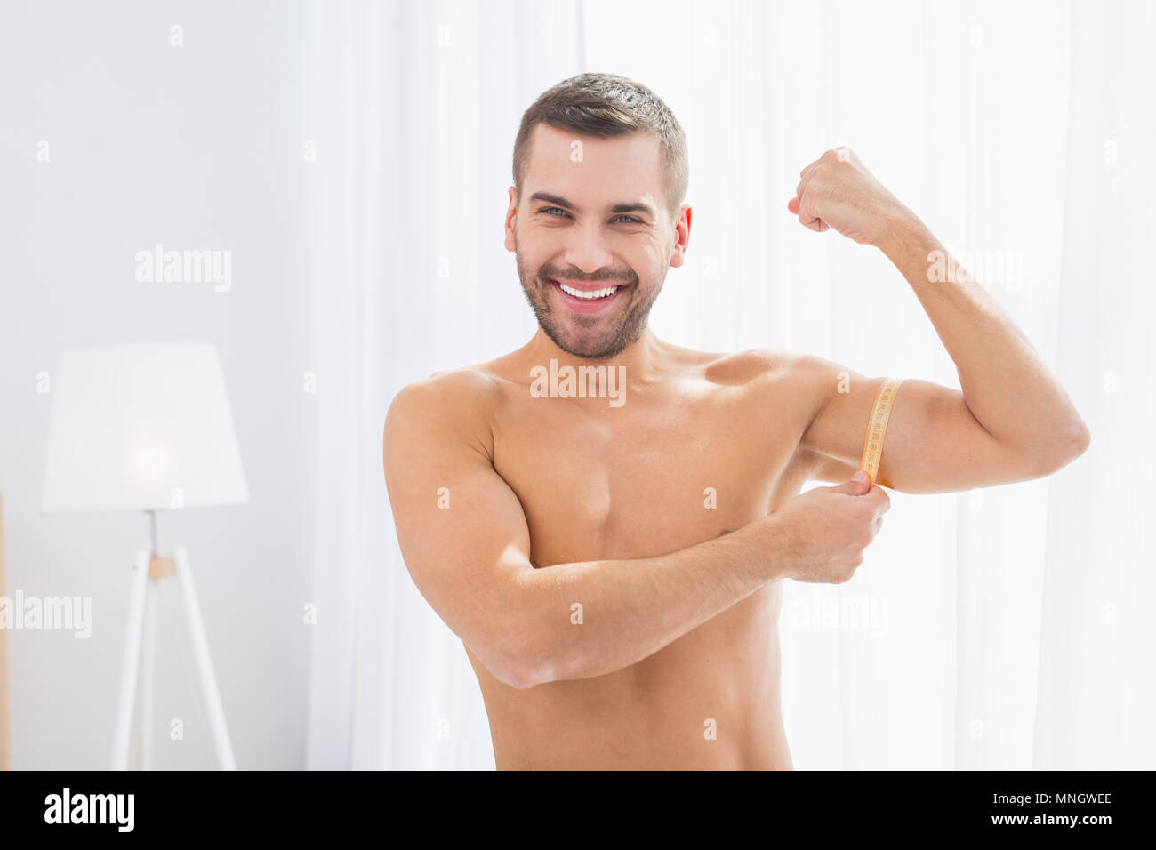 Nice well built man showing his muscles Stock Photo