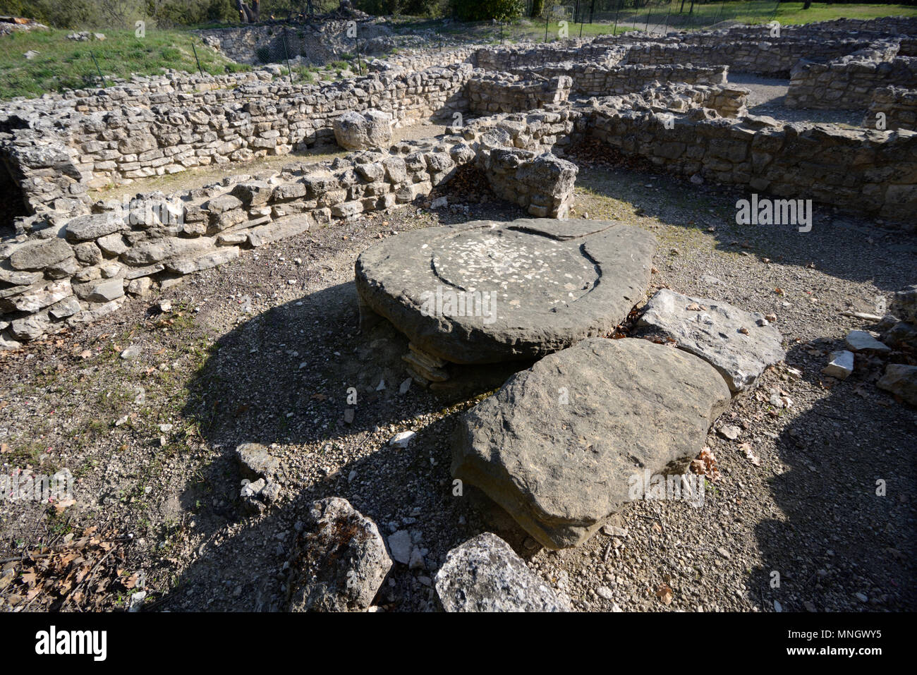 Antique Stone Olive Press or Wine Press & Ruined Houses in Entremont Oppidum (180-170BC), Celtic-Ligurian Capital of the Salyes, Aix-en-Provence Stock Photo