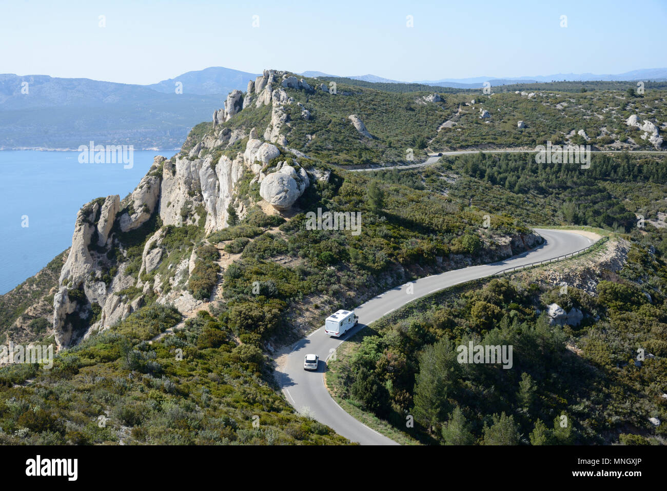 Caravan or Camping Car Driving along the Route des Crêtes Coast Road in the Caranques National Park Cassis Provence France Stock Photo