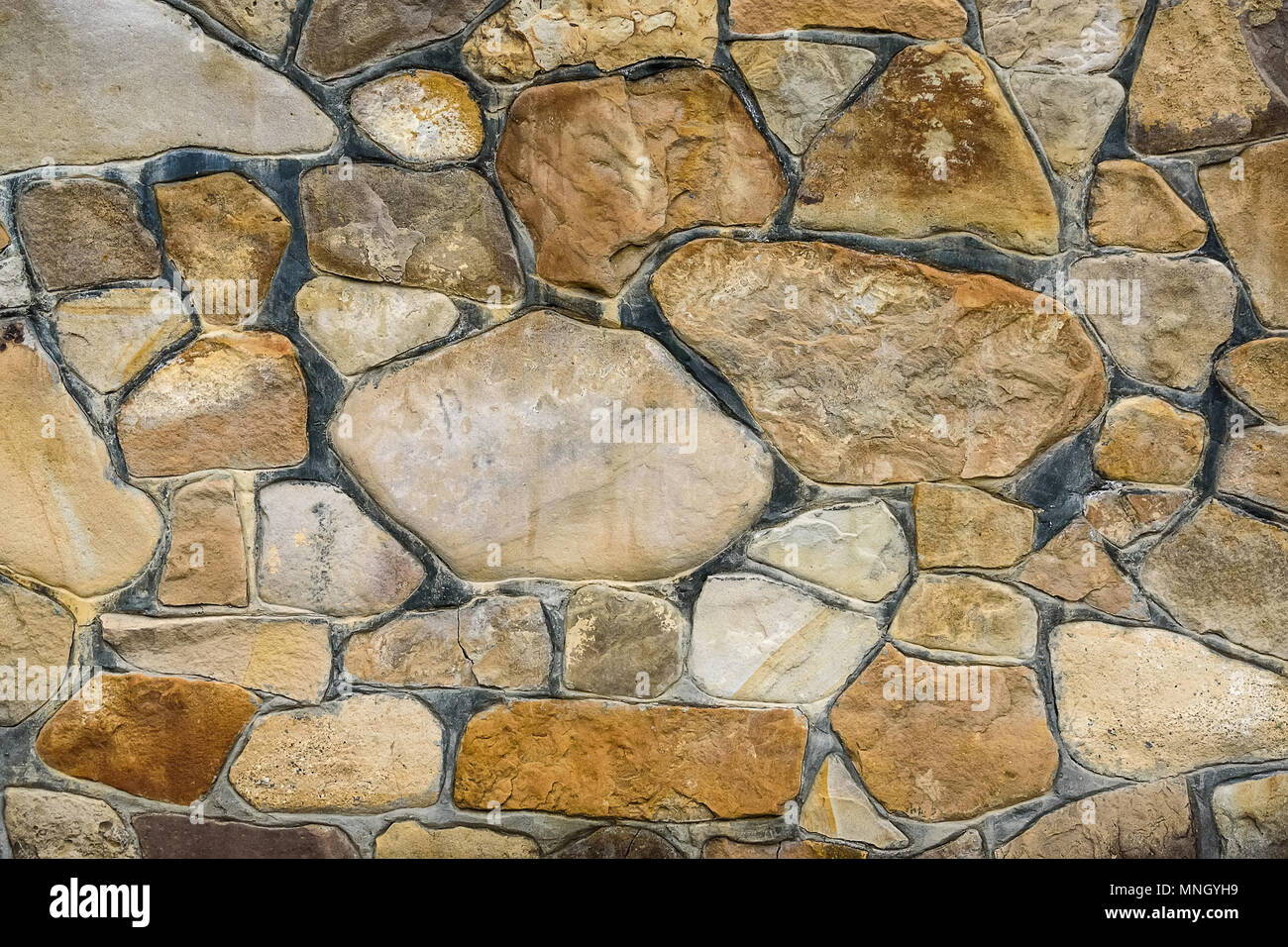 Closeup of beige rough uneven actique stone wall Stock Photo - Alamy